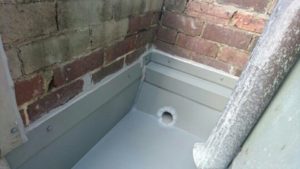Guttering and downpipe.