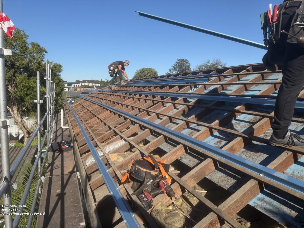 All Roofing Services team working on a metal roof in Sydney